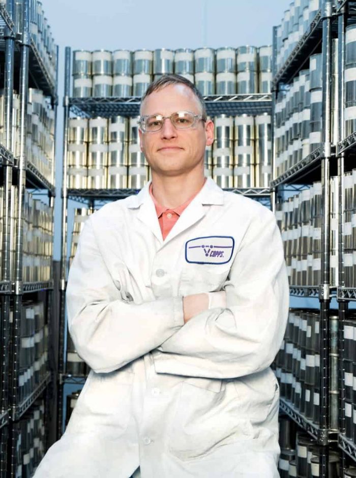 Copps Scientist sitting with resin